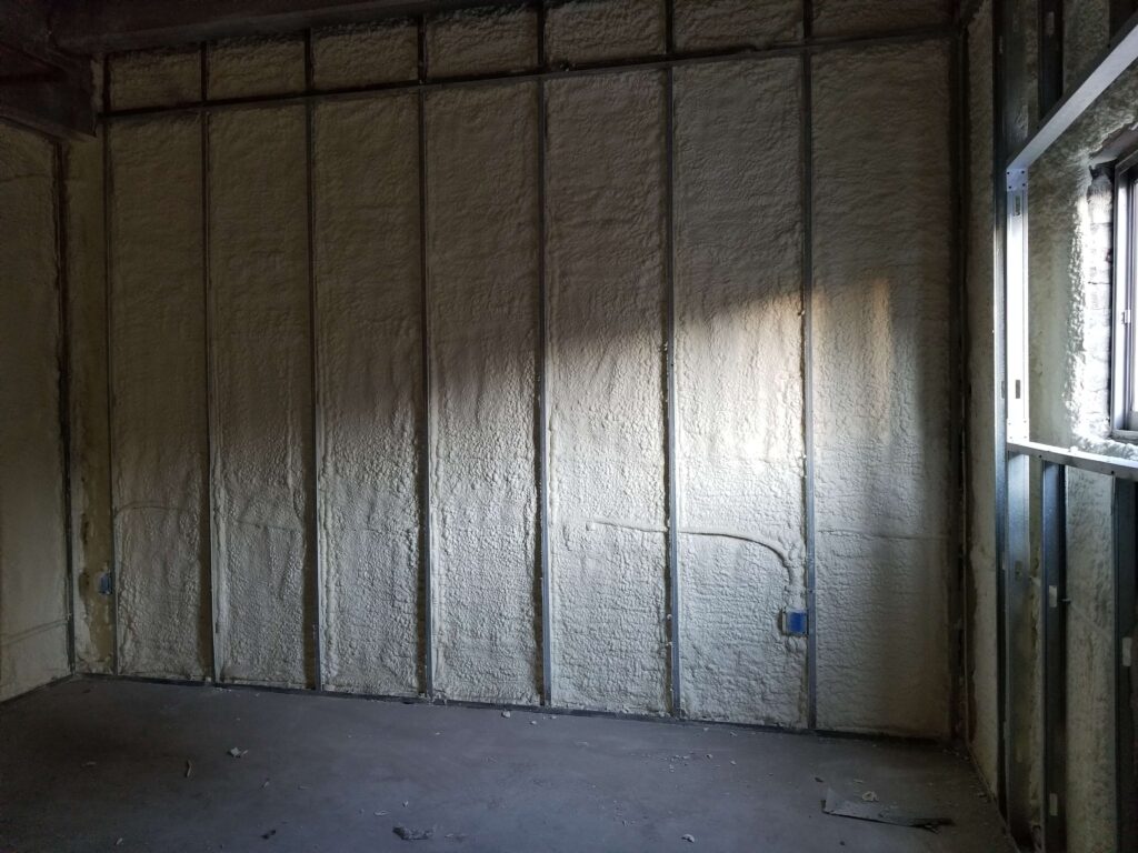 spray foam in a commercial wall with metal framing