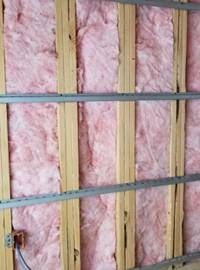 pink fiberglass insulation in a wall