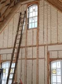 spray foam insulation in a large residential wall