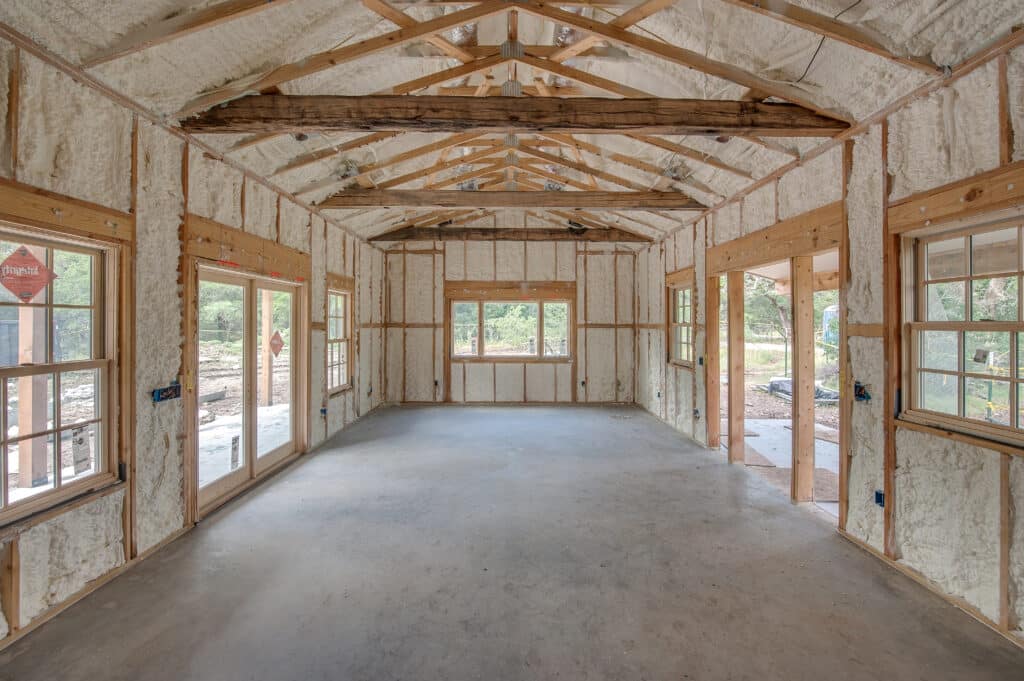 Spray foam insulation is shown in various parts of a new build